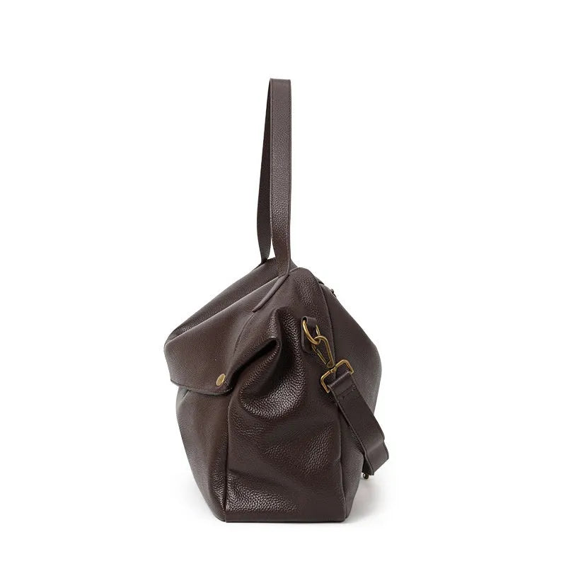Brown genuine leather women's shoulder bag with horizontal square design showing interior zippered compartment