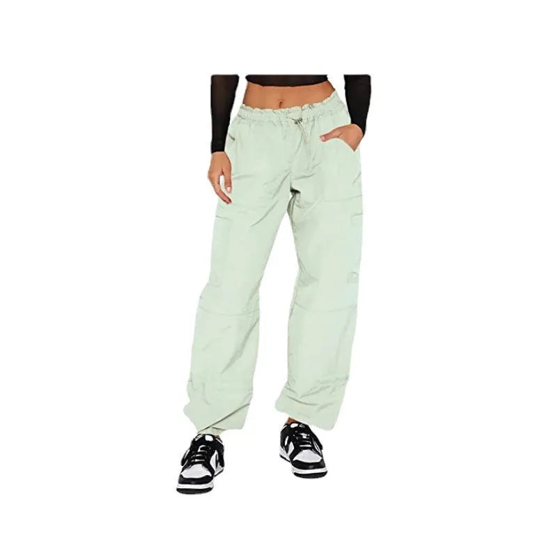 Loose-fit straight-leg cargo casual pants in grey with multiple pockets, shown on a hanger.