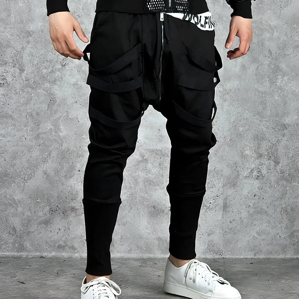 Low crotch cross pants for men in black with tapered leg and small foot opening