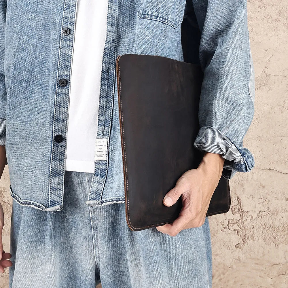 Men's brown Crazy Horse leather horizontal laptop liner bag showing first-layer cowhide texture