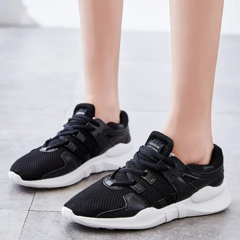 Low-top mesh sneakers in white with a hollow-out EVA sole design on a solid colour background.