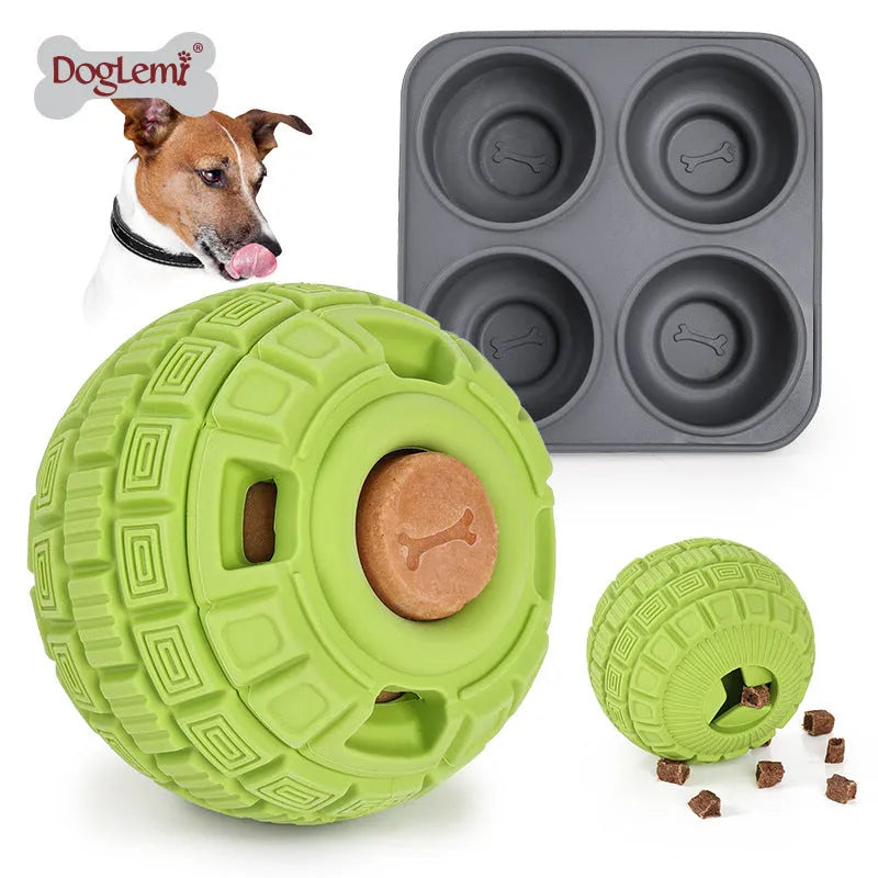 Natural rubber food dropping ball pet toy in green and orange, 14cm long, on light background