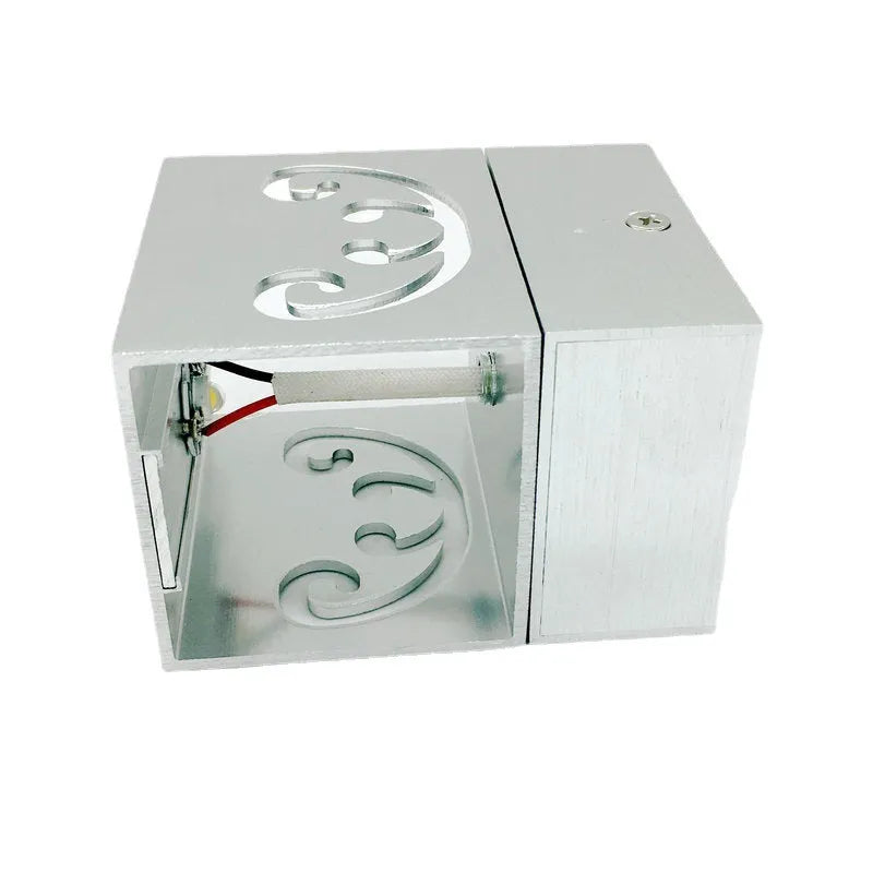 Modern silver aluminium butterfly-shaped LED wall lamp with multi-colour light options.