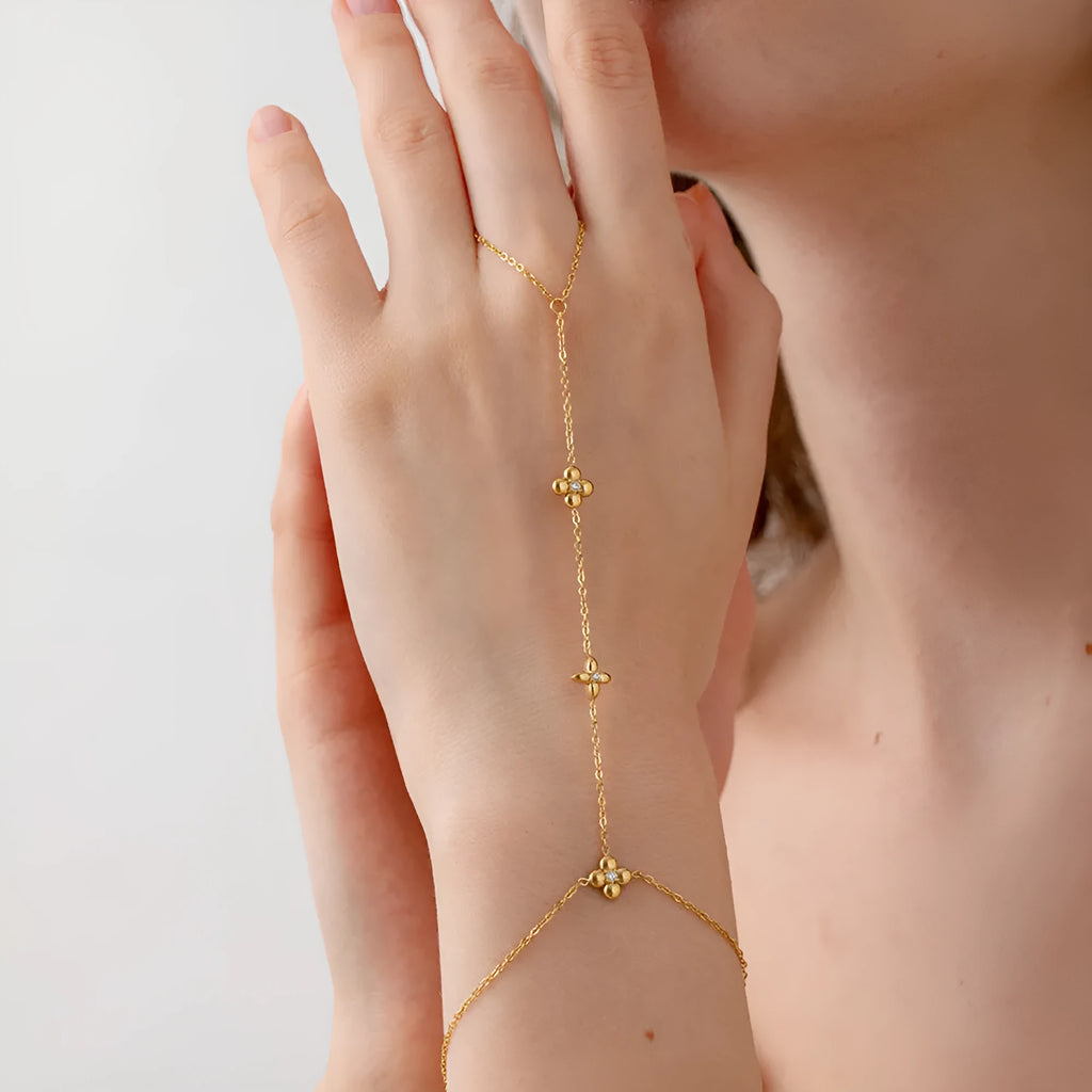 Women's gold-coloured stainless steel bracelet with floral and eight-pointed star geometric designs