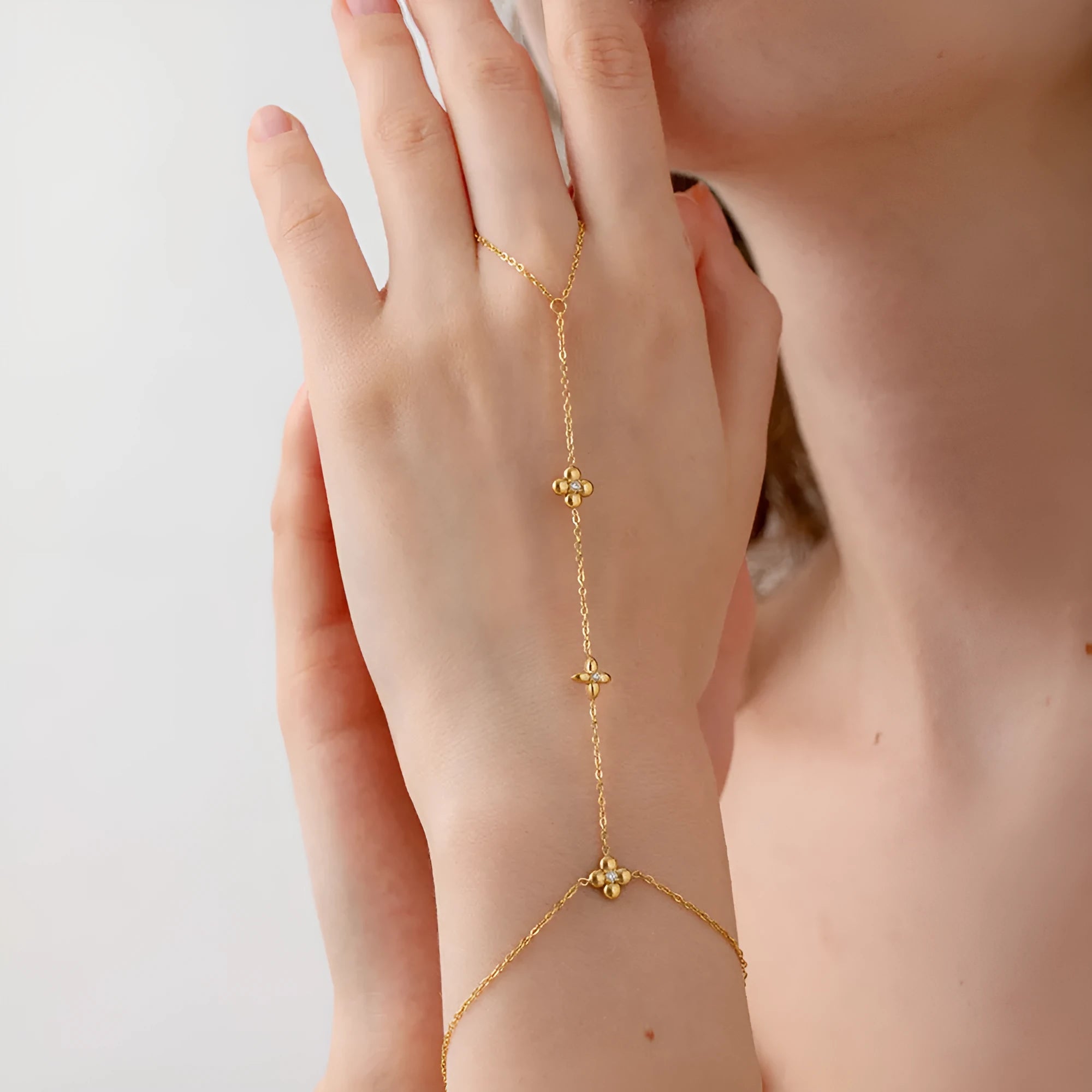 Women's gold-coloured stainless steel bracelet with floral and eight-pointed star geometric designs