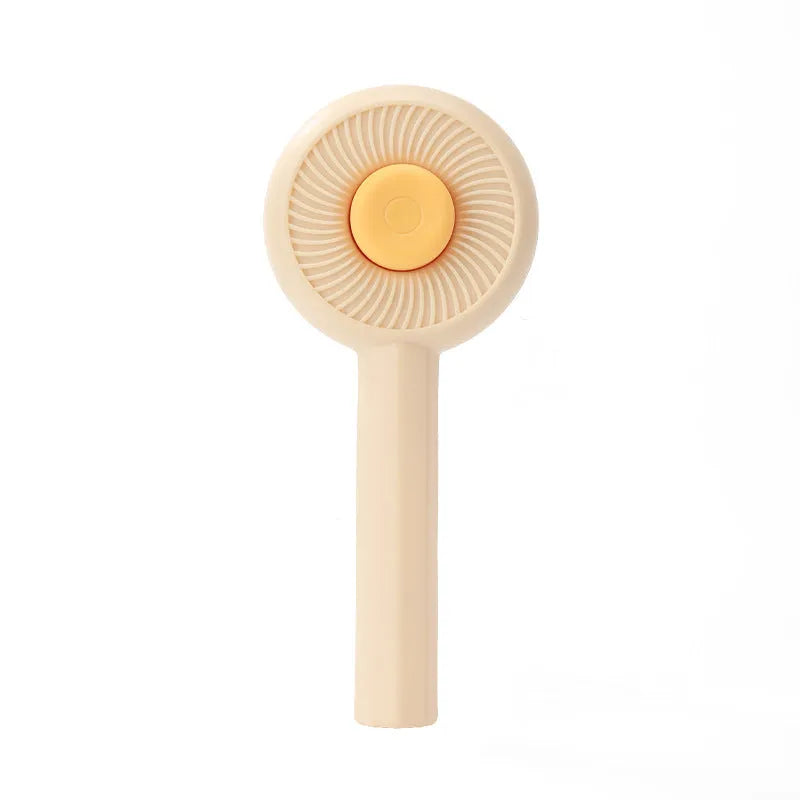 Blue and yellow pet grooming brush with self-cleaning button and angled needles