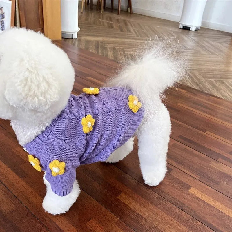 Purple knitted flower print dog clothes with size options from XS to XL on a plain background