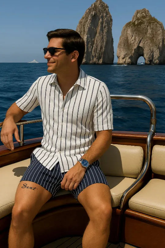 Man wearing a light mature casual beach shirt and shorts set made from four-sided elastic fabric.