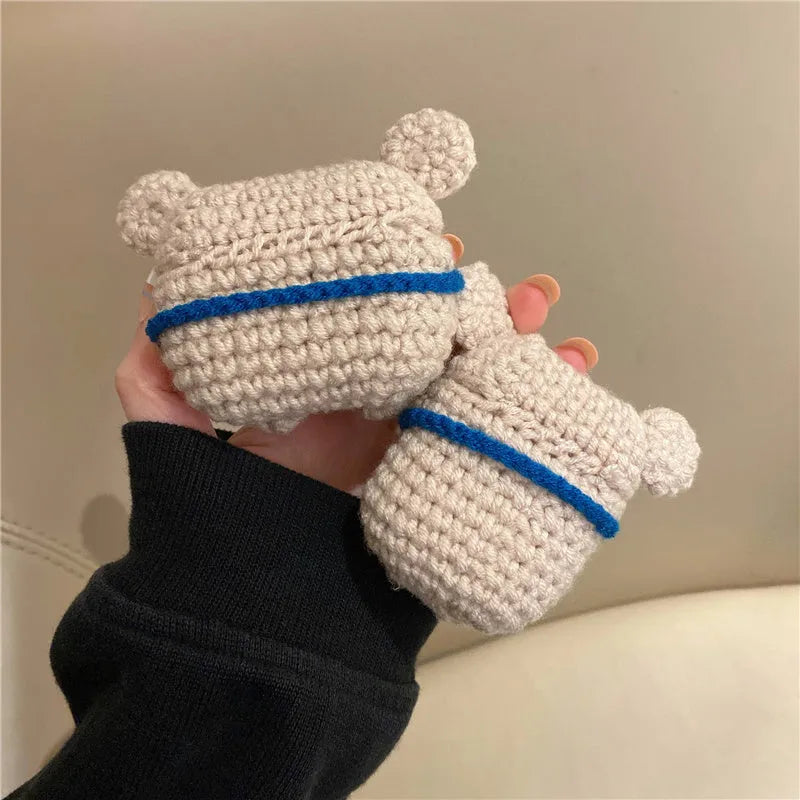 Hand-knitted koala bear backpack design cover for Apple AirPods charging case on a white background.