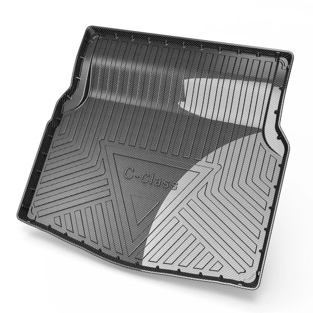 Black carbon fibre pattern TPE boot liner for a Special Car, showing textured surface and custom fit.