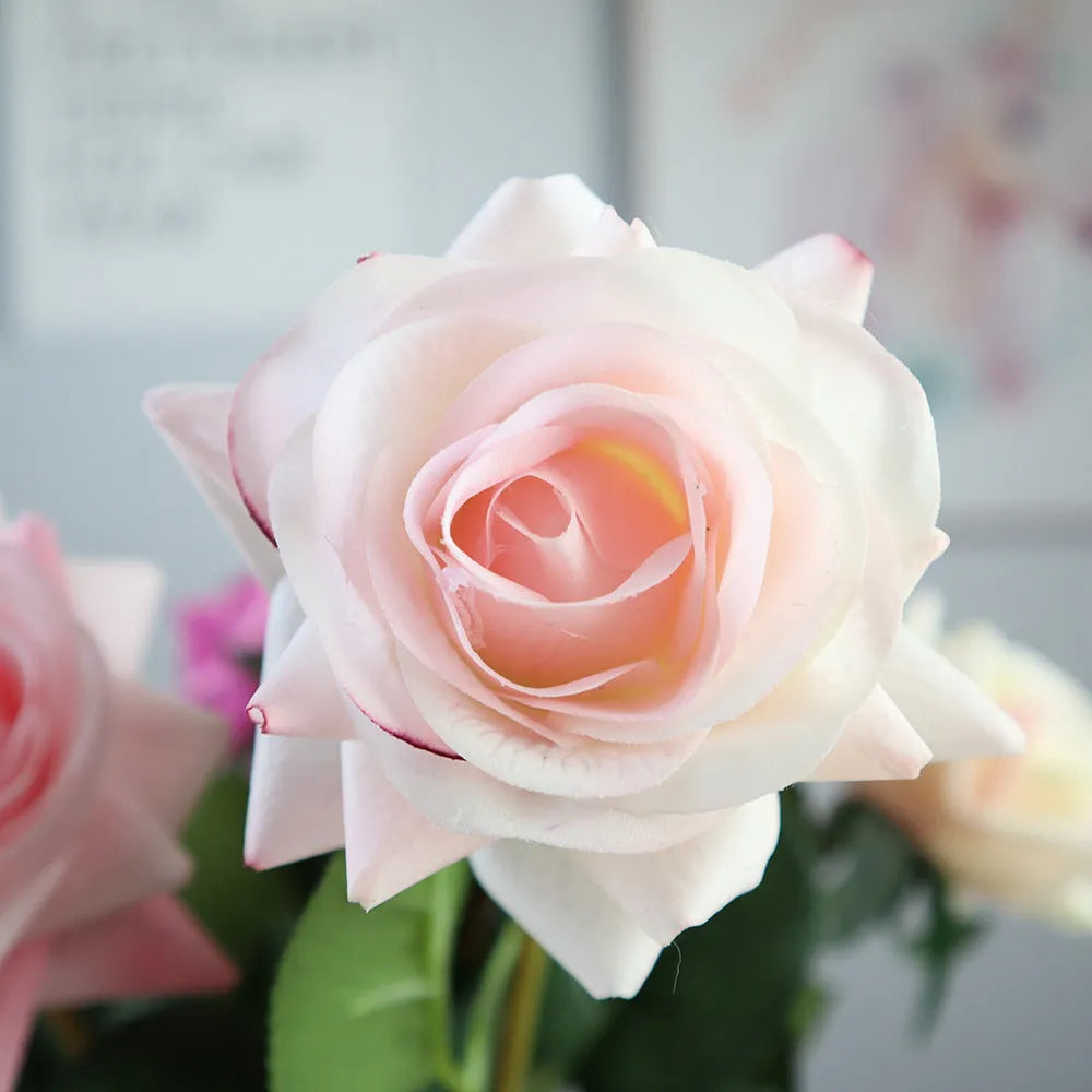Artificial silk flower bouquet with red petals and green leaves measuring 42cm long
