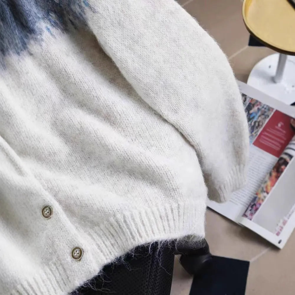 Women's jacquard knit sweater coat in a contrast colour, shown in a loose fit.
