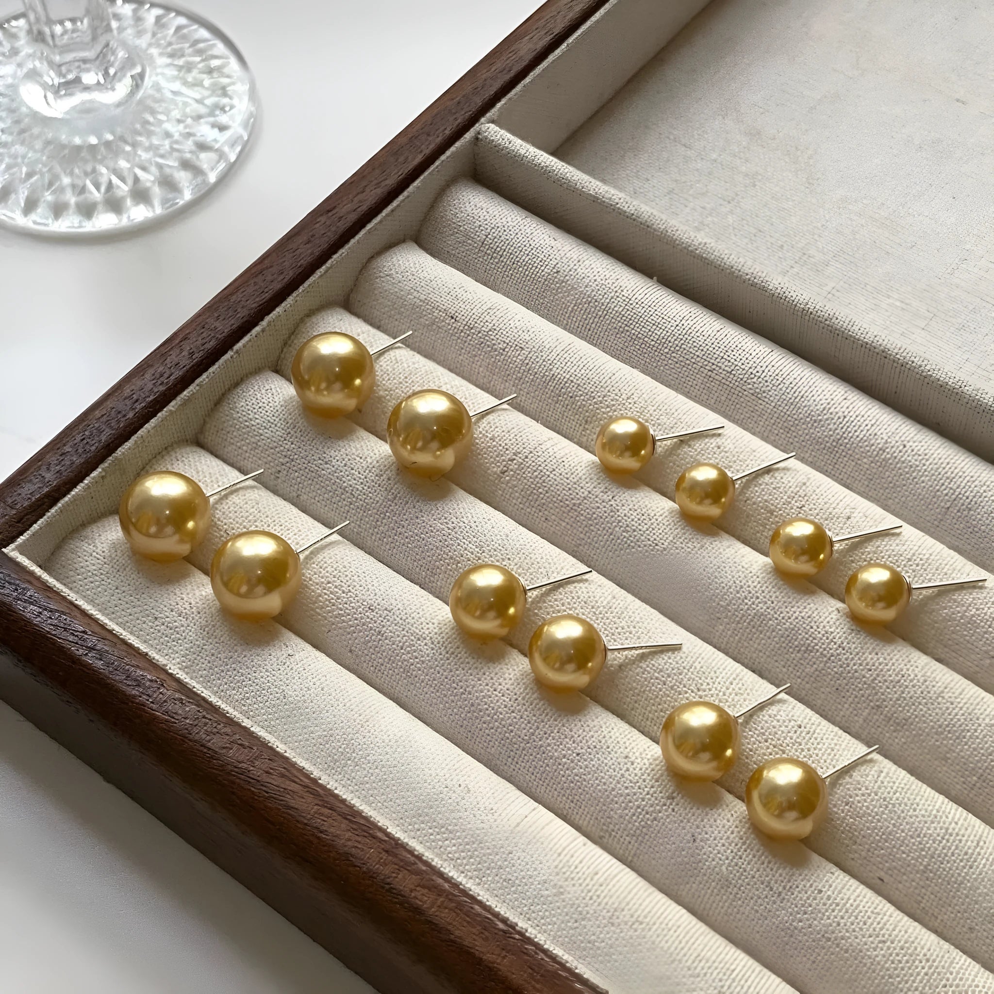 Large geometric pearl stud earrings with retro styling and eight-point star detail in silver