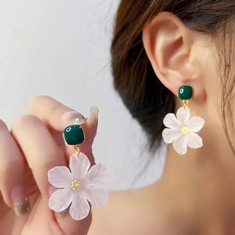 Dark green sweet flower dangle earrings with needle detailing on petals and sterling silver ear wires