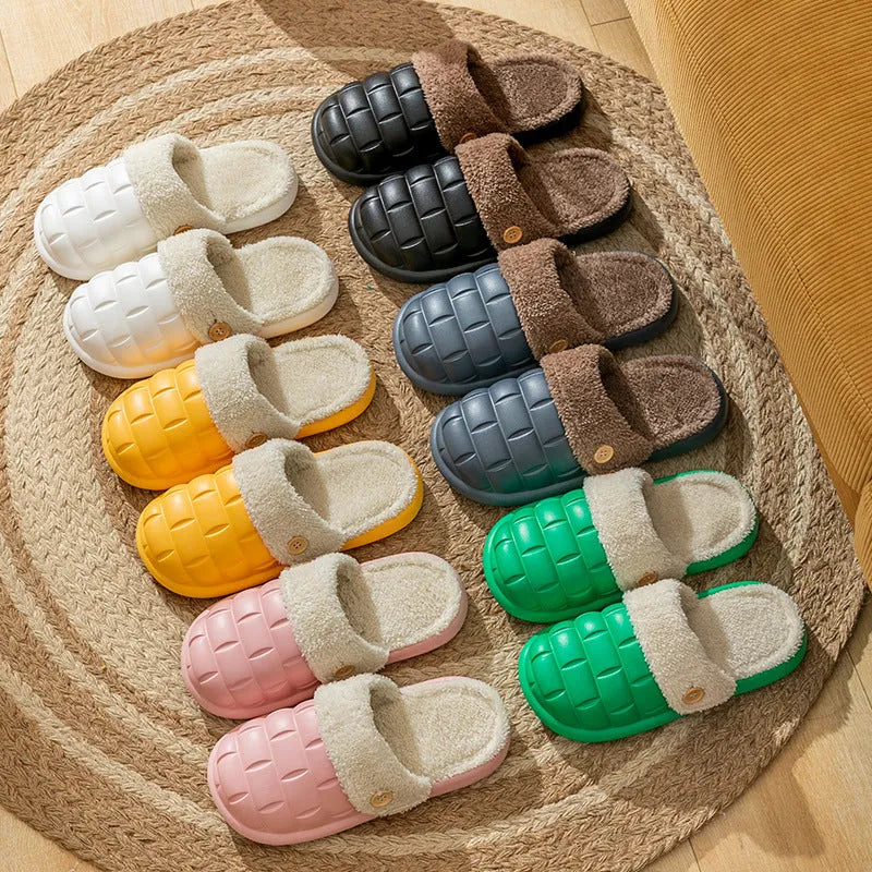 Women's pink and grey plaid EVA slippers with a detachable upper and plush lining on a wooden floor.