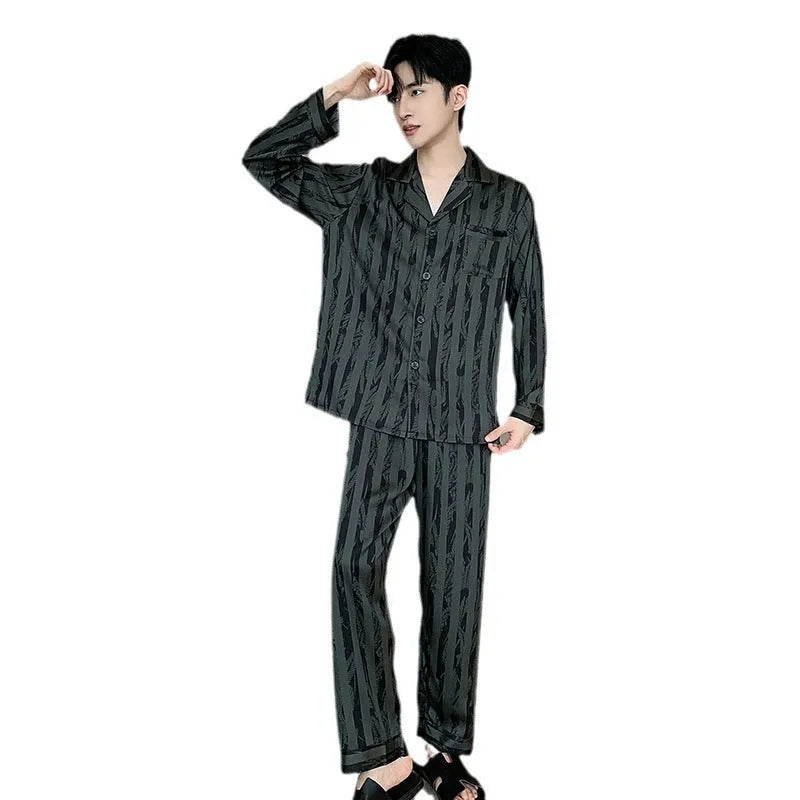 High-grade ice silk men's pyjama set V-neck long sleeve top and thin trousers in black stripes on a neutral background