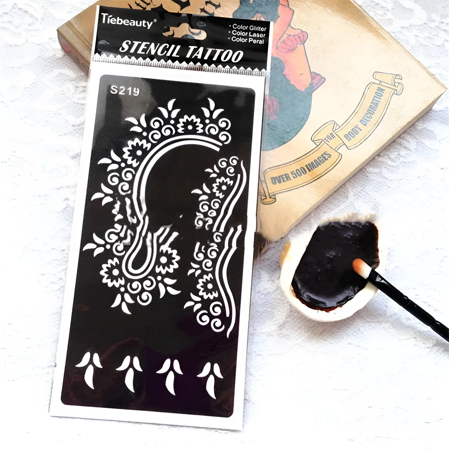 Creative semi-permanent hollow tattoo template sticker with water transfer paper in geometric Southeast Asian style, available in multiple colour options.