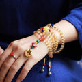Natural citrine bracelet with red and yellow 1mm beads on filament string in light luxury style