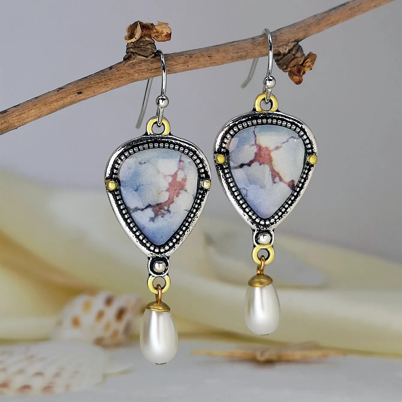 Retro blue geometric drop earrings with synthetic opal and pearl detailing on two-tone electroplated metal