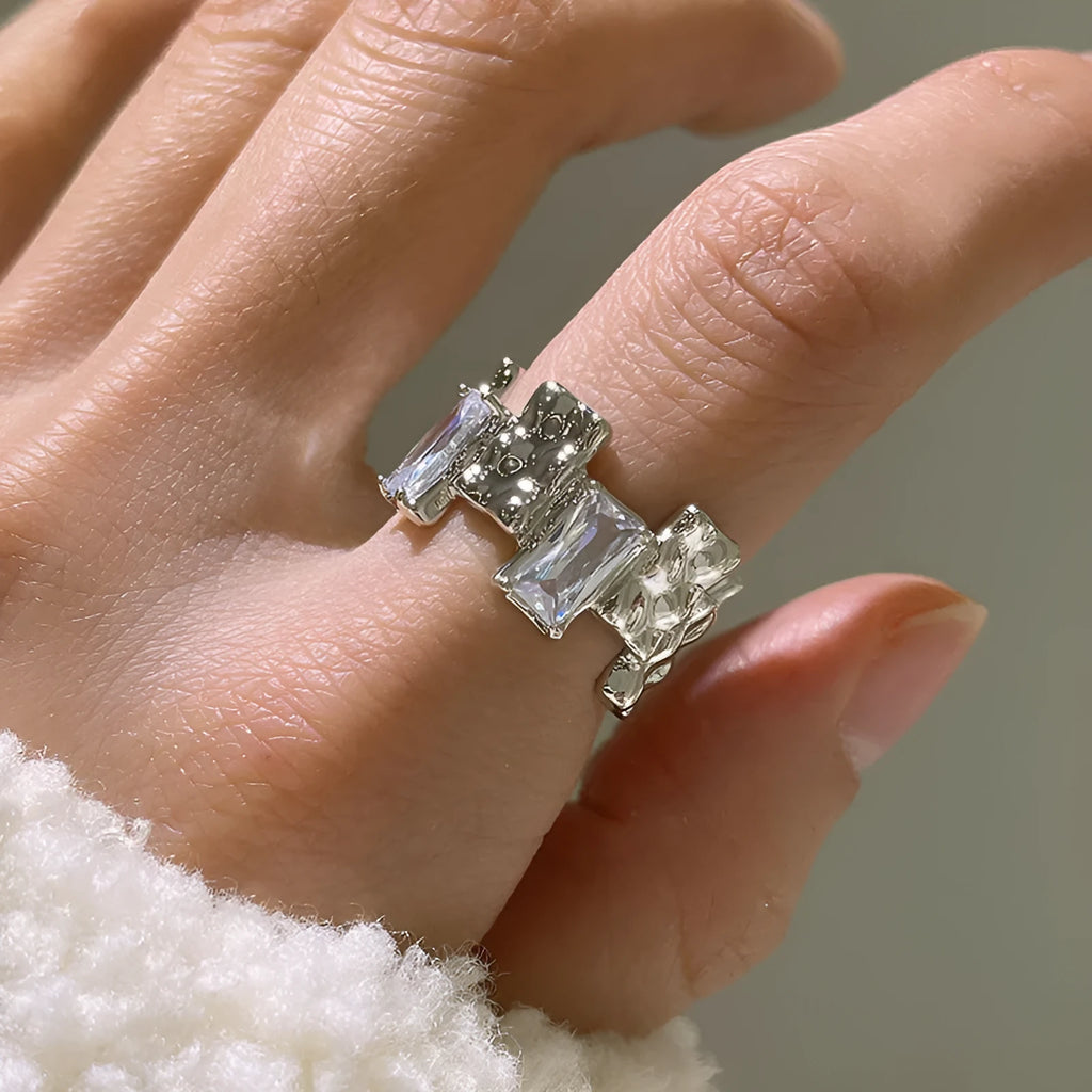 Silver geometric cross ring with zircon detail and open retro design