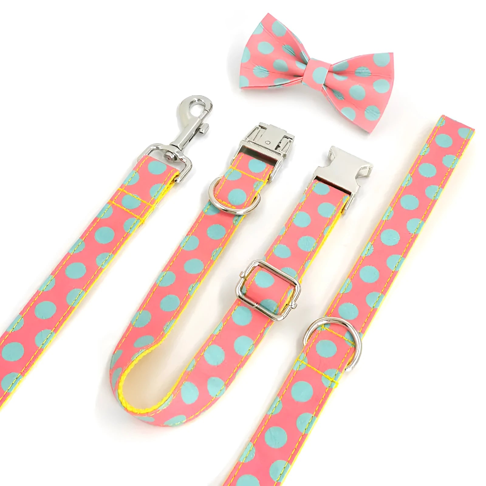 Yellow polka dot dog collar with bow and matching hand-held traction rope on white background