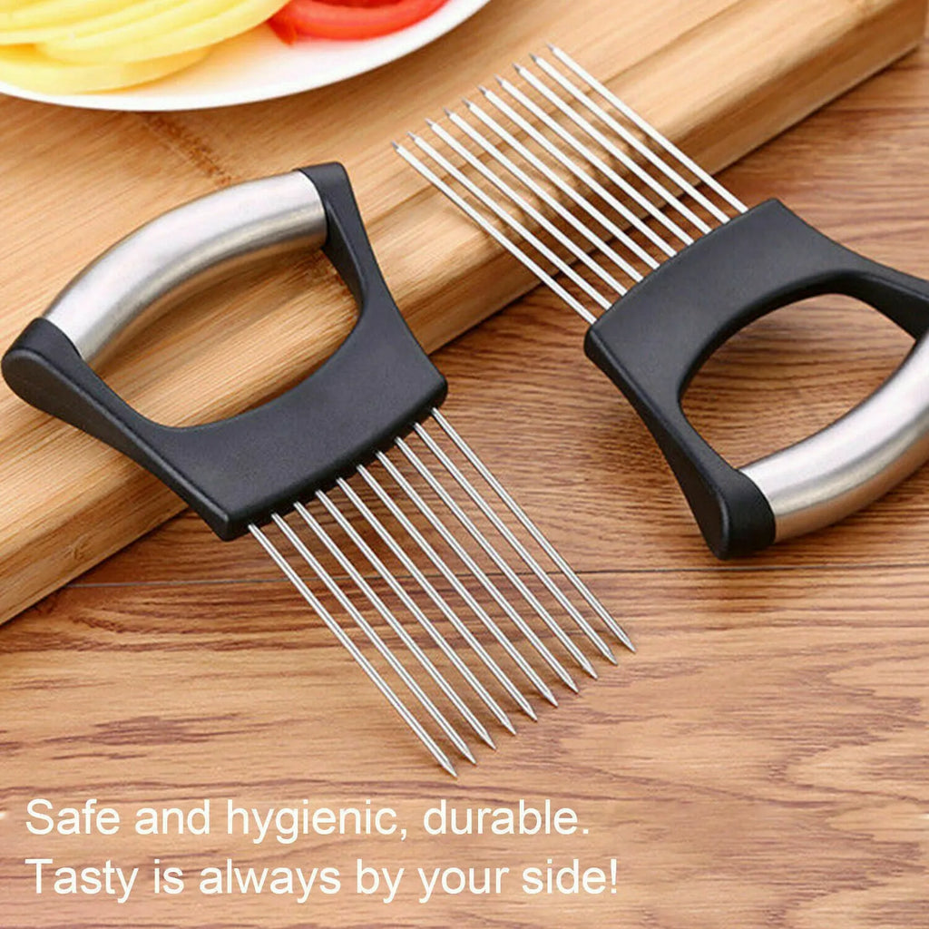 Stainless steel onion holder slicer with non-slip base on a kitchen counter next to a tomato and knife