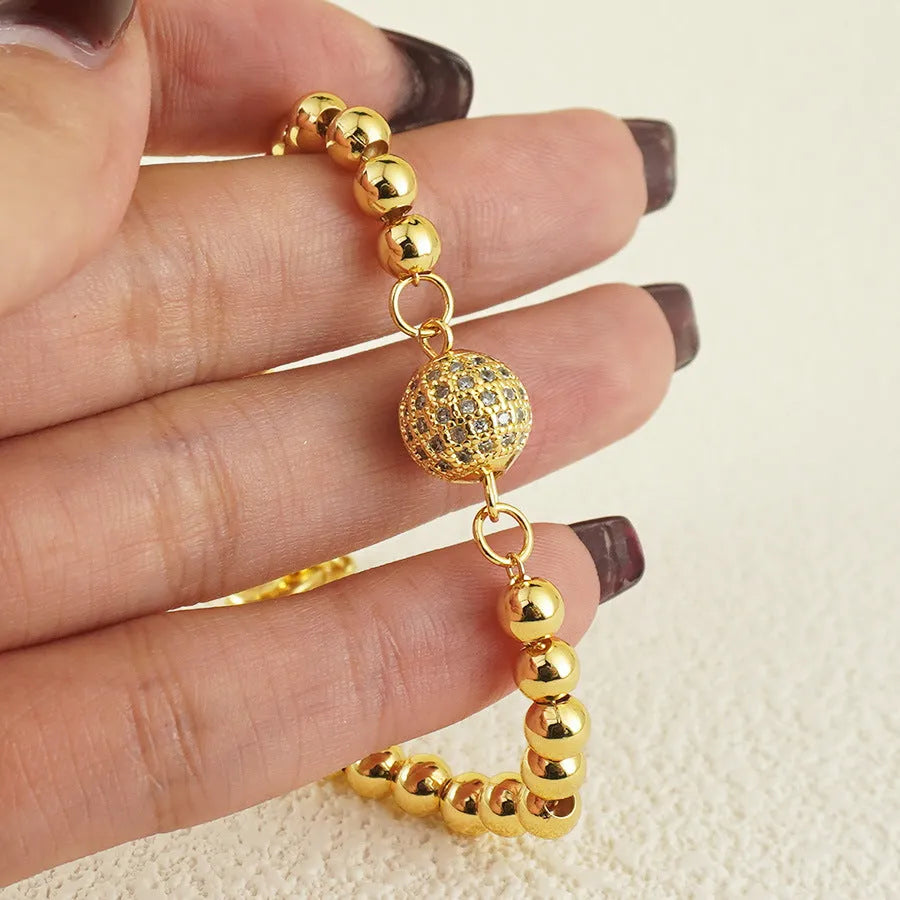 Women's electroplated copper bracelet with heart shape and round ball zircon in Arabic style design