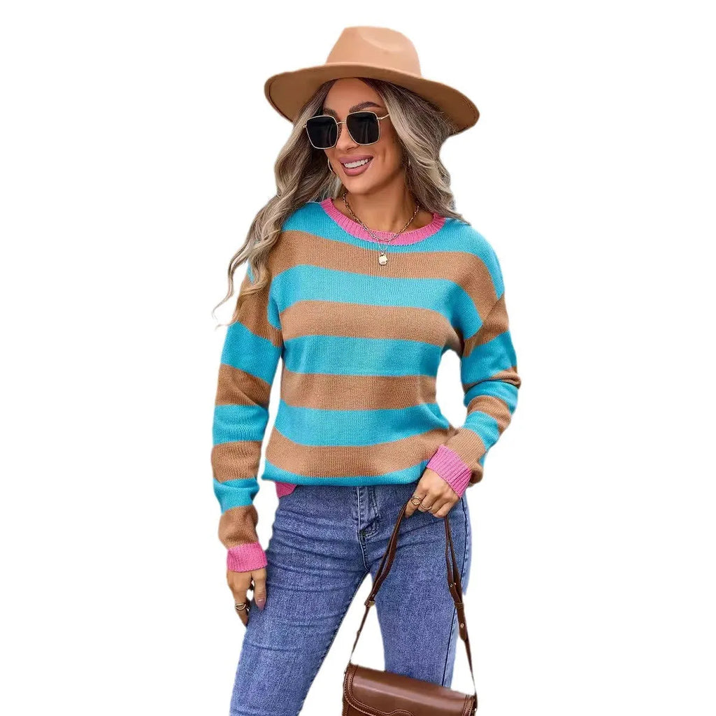 Loose fit women's acrylic sweater with round neck and long sleeves on a hanger