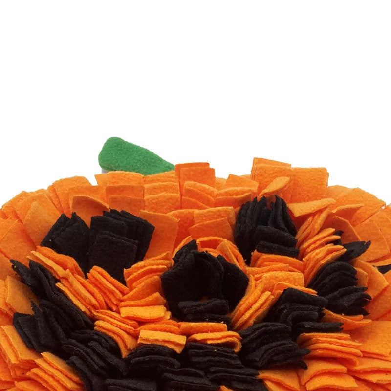 Orange pumpkin-shaped pet sniffing mat with soft fur fabric, 30cm diameter, on a wooden floor