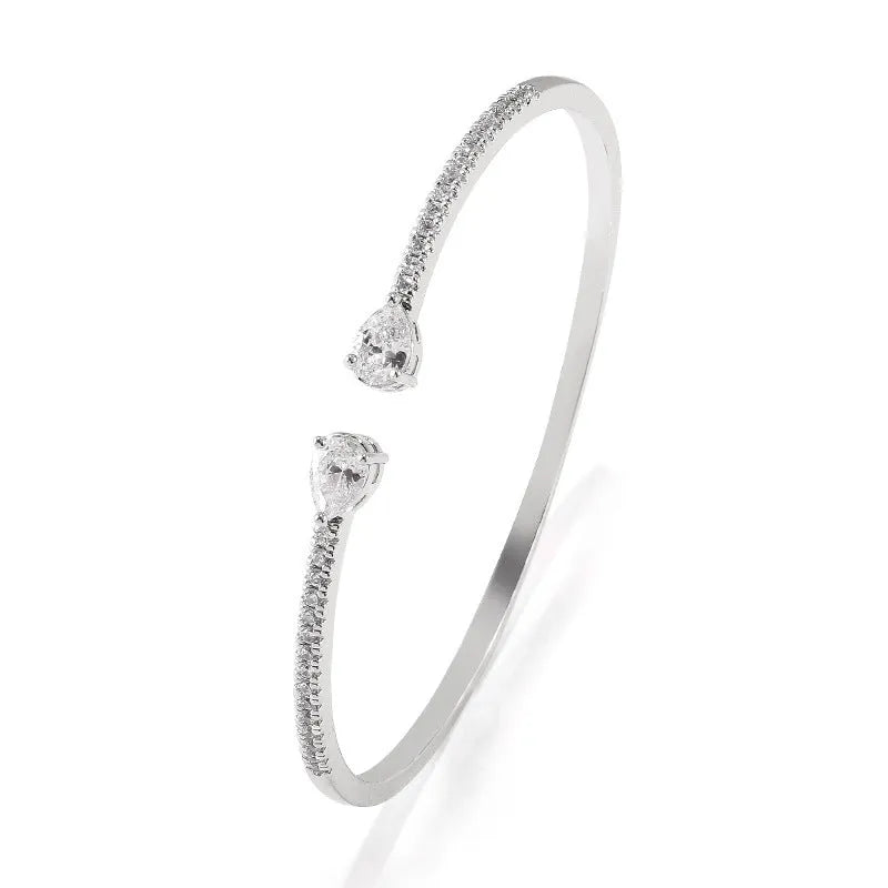 Copper bracelet with multi-zircon inlay in blue or white colour options