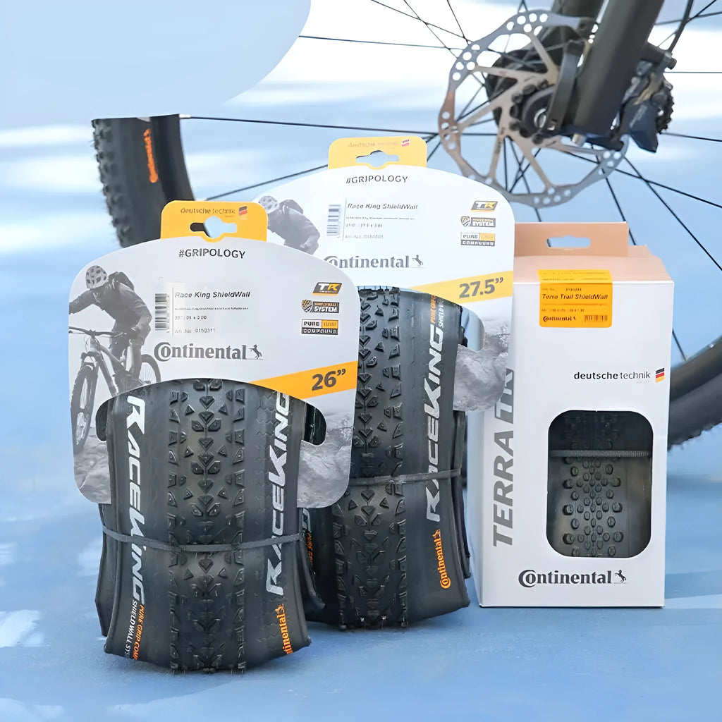 Mountain bike folding tyre showing tread pattern and sidewall with size specifications visible