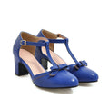 Women's apricot coloured chunky heel sandals with a buckle strap and bow tie detail on a 6.5cm heel.