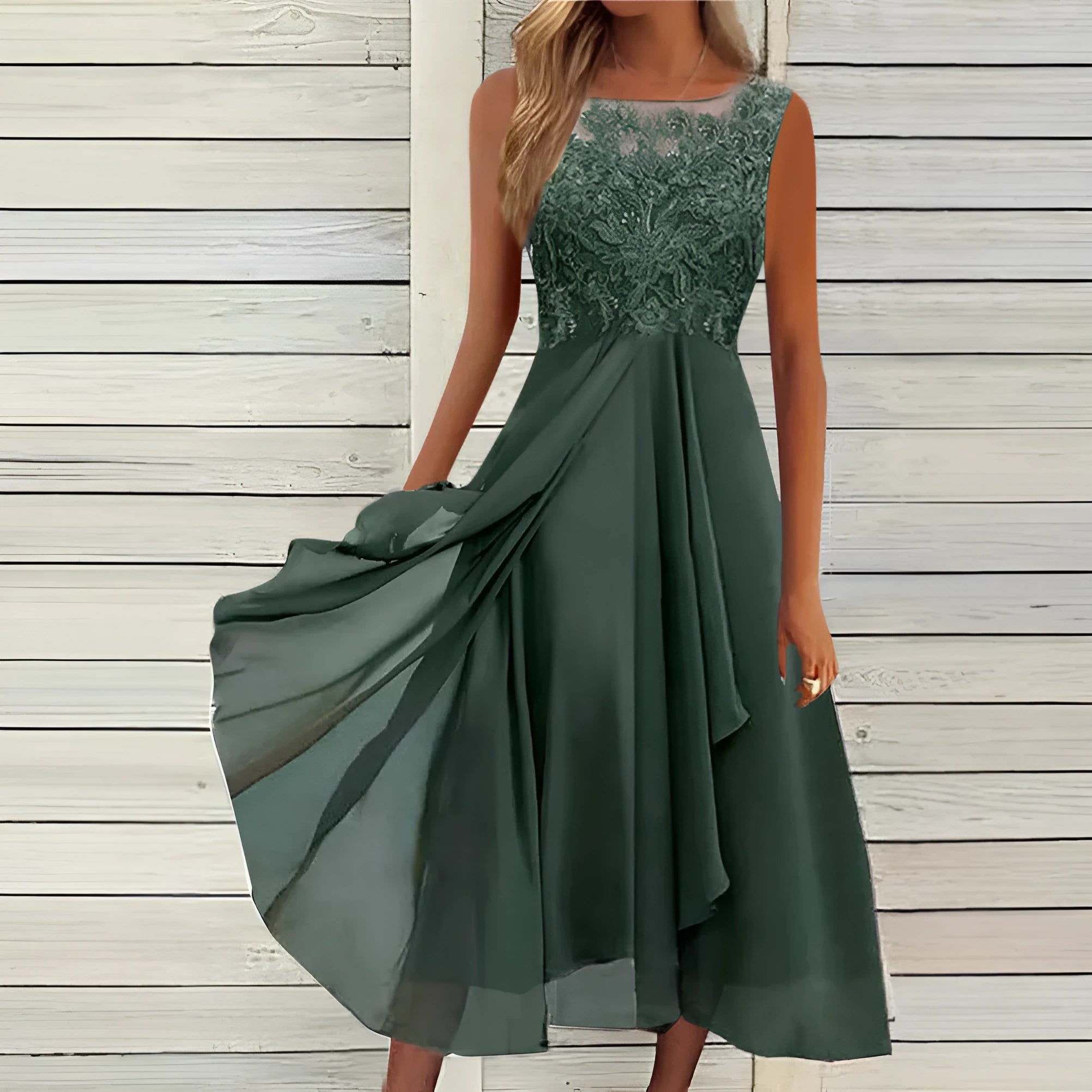 Women's sleeveless green chiffon dress with lace detailing and a mid-length skirt.