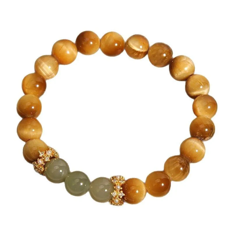 Natural yellow tiger's eye bracelet with U-shaped design showing auspicious patterns and traditional symbolic charms