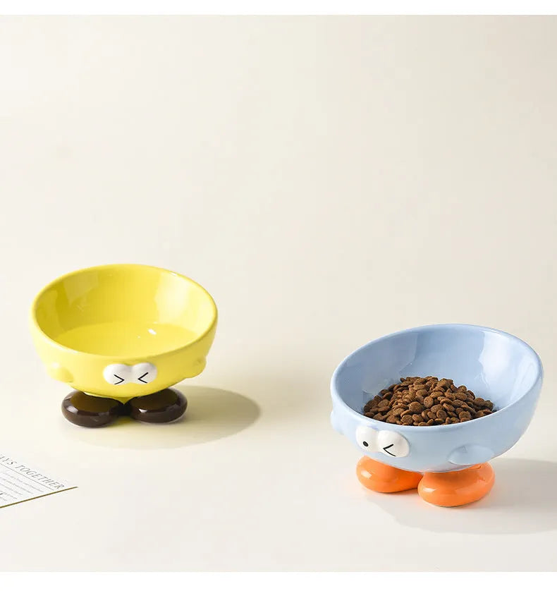 Oblique ceramic cat food bowl with cute expression print in blue for cervical spine protection