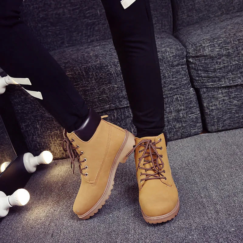 Pink men's high-top Martin boots with front laces and a velvet lining.