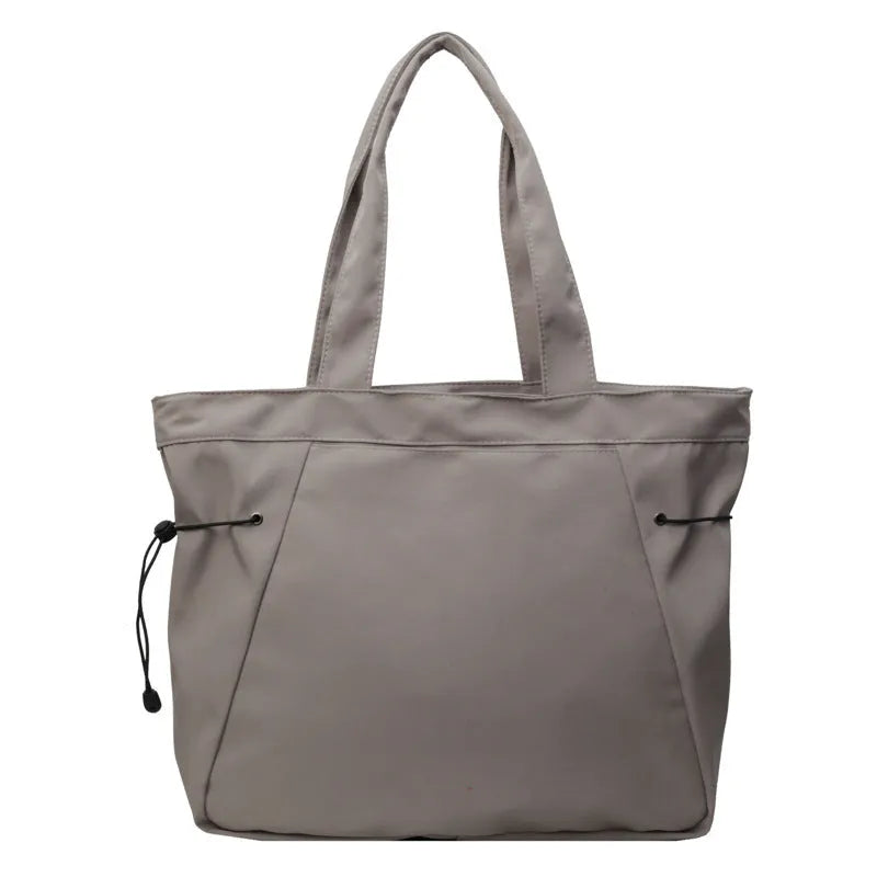 Soft folding Oxford cloth tote bag in a street style, shown in multiple colour options.