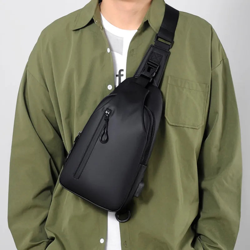 Black sling crossbody chest bag for men, simple city style, vertical square shape, zipper closure, soft surface, blue black grey