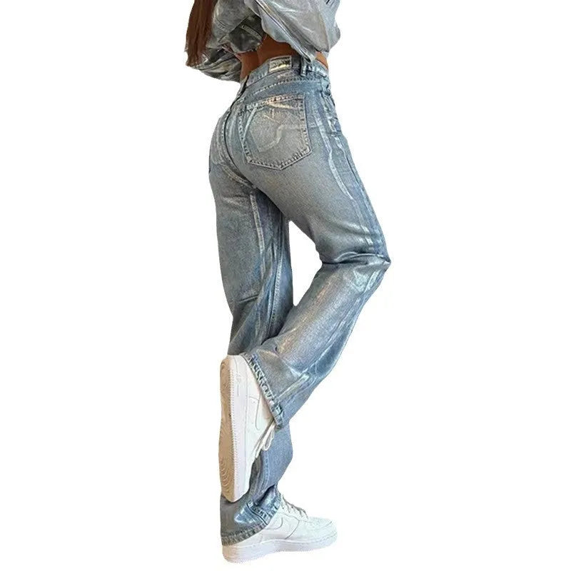 Women's high waist straight leg jeans in washed blue denim with hot silver contrast details