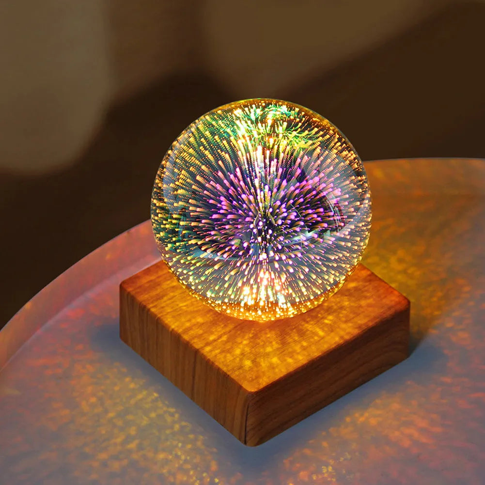 USB 3D firework crystal ball night light with warm LED, touch control, and starry sky effect on a wooden desk