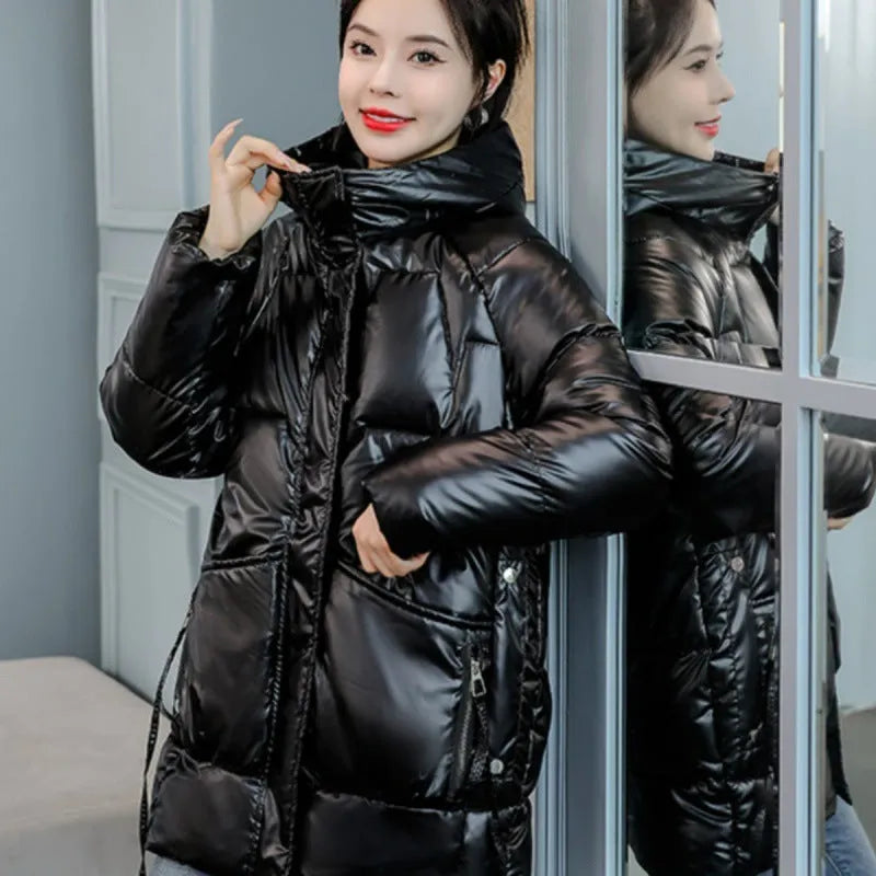 A loose-fitting, thick hooded winter jacket for women in a champagne colour, showcasing long sleeves.