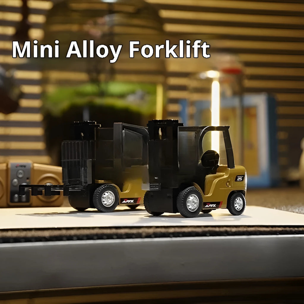 Alloy remote control engineering vehicle set with dump truck, excavator, and small forklift on a table