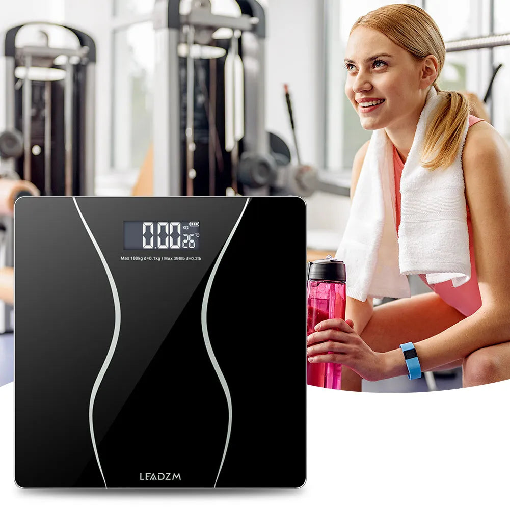 Black electronic body scale with digital display and 180kg weight capacity for household health monitoring