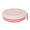 Portable dual-compartment dog bowl in light green, showing main bowl and separate snack box, suitable for outdoor use.