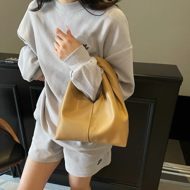 Idle Style Casual Cloud handbag in khaki showing front folding and stitching detail with sandwich pocket