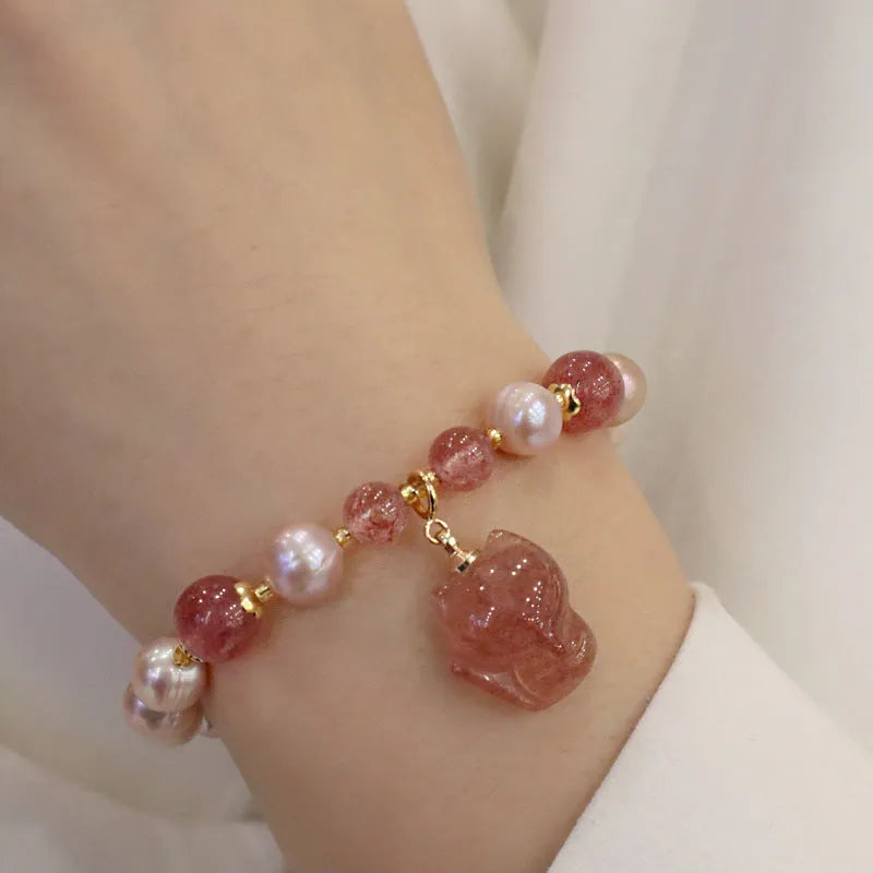 Women's natural freshwater pearl bracelet with light pink pearl, strawberry quartz, and fox charm on string