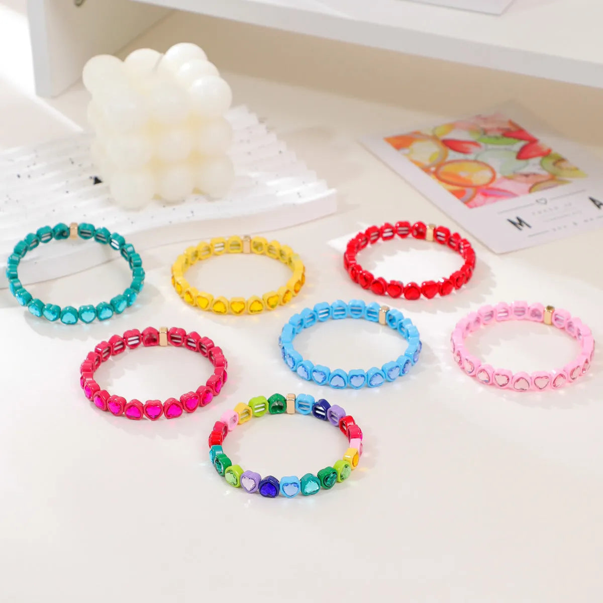 Rainbow enamel alloy heart stretch bracelet in TCSL003 colour variant on a white background