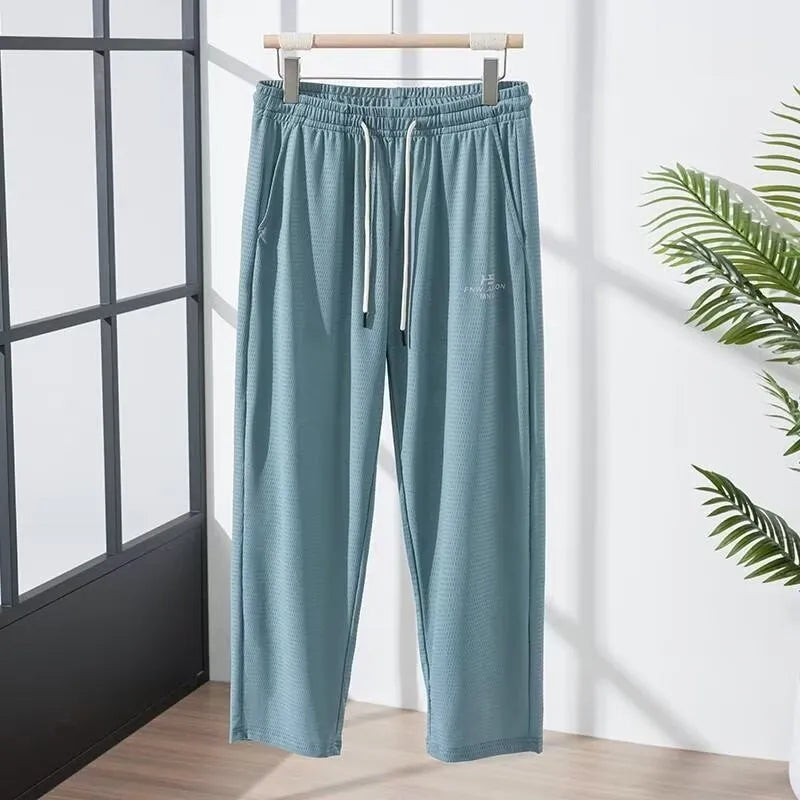 Men's loose ice silk quick-drying casual pants with elastic mesh, straight-leg high-waist, black colour