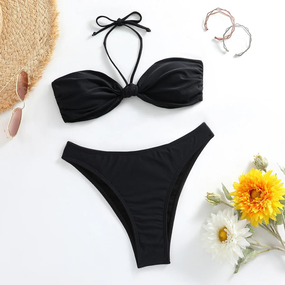 Black women's bikini set with lace-up tube top and briefs on a mannequin
