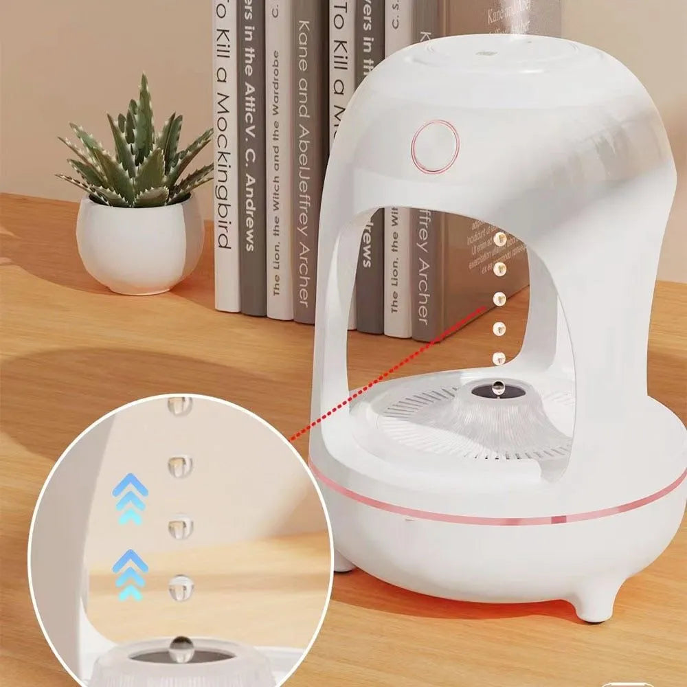 Anti gravity levitating water drops humidifier with LED night light, rose gold white, on desk